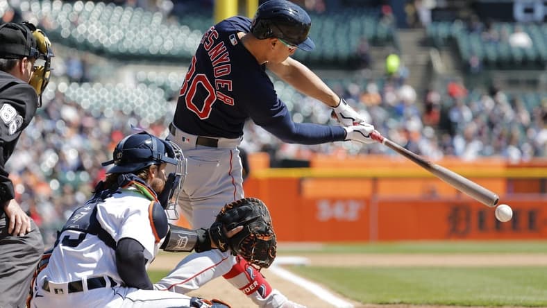 Apr 9, 2023; Detroit, Michigan, USA; Boston Red Sox right fielder Rob Refsnyder (30) hits an RBI single in the fifth inning against the Detroit Tigers at Comerica Park. Mandatory Credit: Rick Osentoski-USA TODAY Sports
