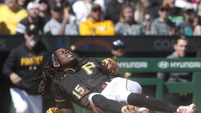 Apr 9, 2023; Pittsburgh, Pennsylvania, USA; Pittsburgh Pirates shortstop Oneil Cruz (15) reacts after collision at home plate against the Chicago White Sox during the sixth inning at PNC Park. Cruz would exit the game. Mandatory Credit: Charles LeClaire-USA TODAY Sports