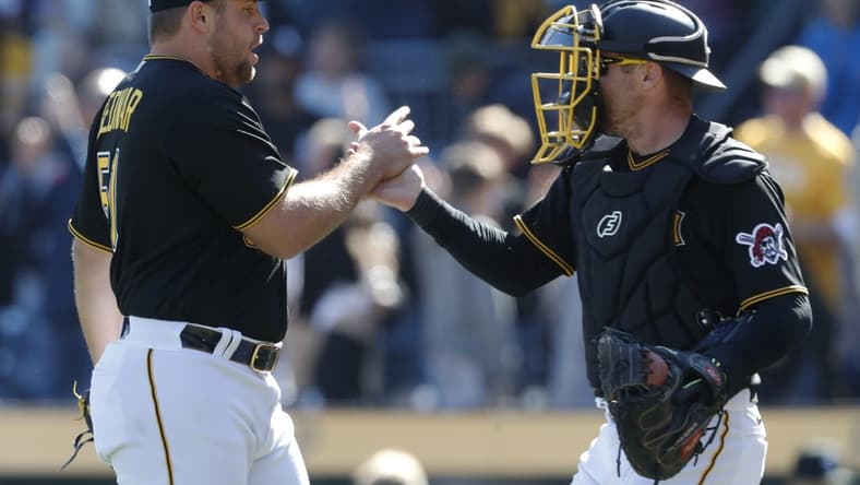 Apr 9, 2023; Pittsburgh, Pennsylvania, USA;  Pittsburgh Pirates relief pitcher David Bednar (51) and catcher Tyler Heineman (54) celebrate after defeating the Chicago White Sox at PNC Park. The Pirates shutout Chicago 1-0. Mandatory Credit: Charles LeClaire-USA TODAY Sports