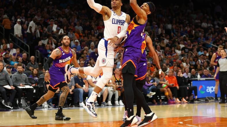 Apr 9, 2023; Phoenix, Arizona, USA; Los Angeles Clippers guard Russell Westbrook (0) drives to the basket against the Phoenix Suns in the first half at Footprint Center. Mandatory Credit: Mark J. Rebilas-USA TODAY Sports