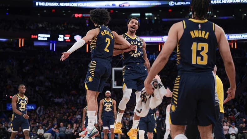 Apr 9, 2023; New York, New York, USA; Indiana Pacers guard George Hill (7) celebrates with guard Chris Duarte (3) and forward Jordan Nwora (13) after a basket during the second half against the New York Knicks at Madison Square Garden. Mandatory Credit: Vincent Carchietta-USA TODAY Sports