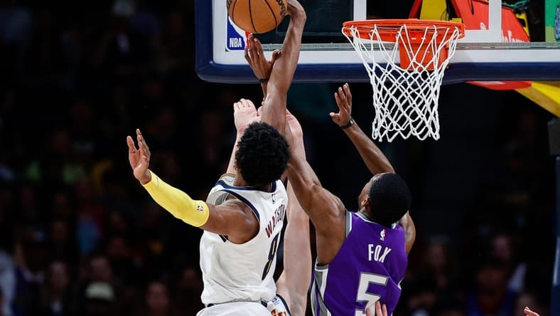 Apr 9, 2023; Denver, Colorado, USA; Denver Nuggets forward Peyton Watson (8) blocks the shot attempt of Sacramento Kings guard De'Aaron Fox (5) in the second quarter at Ball Arena. Mandatory Credit: Isaiah J. Downing-USA TODAY Sports
