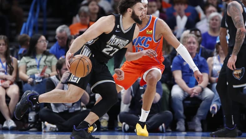 Apr 9, 2023; Oklahoma City, Oklahoma, USA; Memphis Grizzlies forward David Roddy (27) drives to the basket against Oklahoma City Thunder forward Ousmane Dieng (13) during the first half at Paycom Center. Mandatory Credit: Alonzo Adams-USA TODAY Sports