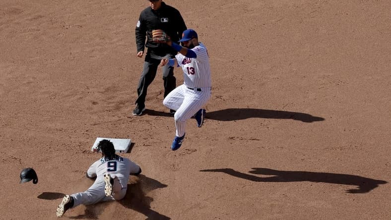 Apr 9, 2023; New York City, New York, USA; Miami Marlins third baseman Jean Segura (9) steals second base as the throw goes over New York Mets second baseman Luis Guillorme (13) allowing Segura to take third base during the eighth inning at Citi Field. Mandatory Credit: Brad Penner-USA TODAY Sports