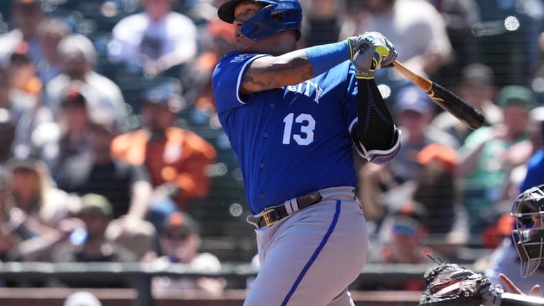 Apr 9, 2023; San Francisco, California, USA; Kansas City Royals designated hitter Salvador Perez (13) hits an RBI single against the San Francisco Giants during the fourth inning at Oracle Park. Mandatory Credit: Darren Yamashita-USA TODAY Sports