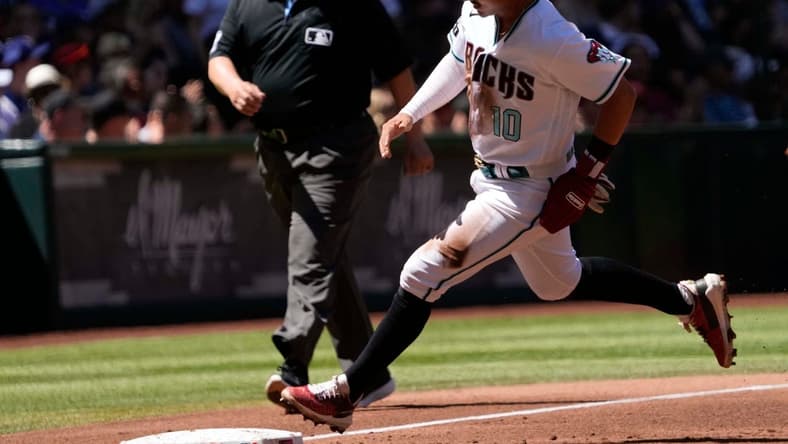 Apr 9, 2023; Phoenix, Ariz., U.S.;  Arizona Diamondbacks 3B Josh Rojas (10) rounds third base before scoring against the Los Angeles Dodgers during the first inning at Chase Field.

Mlb Dodgers At D Backs