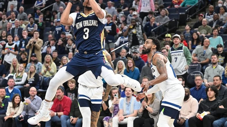 Apr 9, 2023; Minneapolis, Minnesota, USA; New Orleans Pelicans guard CJ McCollum (3) shoots the ball as Minnesota Timberwolves guard Mike Conley (10) looks on during the third quarter at Target Center. Mandatory Credit: Jeffrey Becker-USA TODAY Sports