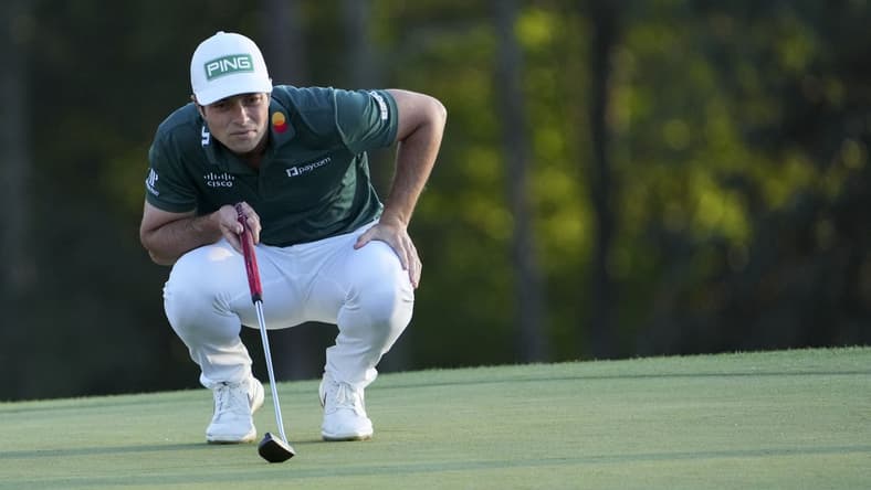 Apr 9, 2023; Augusta, Georgia, USA; Viktor Hovland lines up his putt on the 18th green during the final round of The Masters golf tournament. Mandatory Credit: Danielle Parhizkaran-USA TODAY Network
