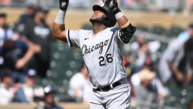 Apr 10, 2023; Minneapolis, Minnesota, USA; Chicago White Sox shortstop Hanser Alberto (26) reacts after hitting a three run home run against Minnesota Twins starting pitcher Kenta Maeda (not pictured) during the fourth inning at Target Field. Mandatory Credit: Jeffrey Becker-USA TODAY Sports