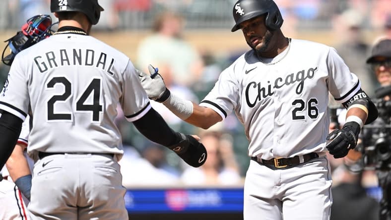 Apr 10, 2023; Minneapolis, Minnesota, USA; Chicago White Sox shortstop Hanser Alberto (26) celebrates with catcher Yasmani Grandal (24) after hitting a three run home run against Minnesota Twins starting pitcher Kenta Maeda (not pictured) during the fourth inning at Target Field. Mandatory Credit: Jeffrey Becker-USA TODAY Sports