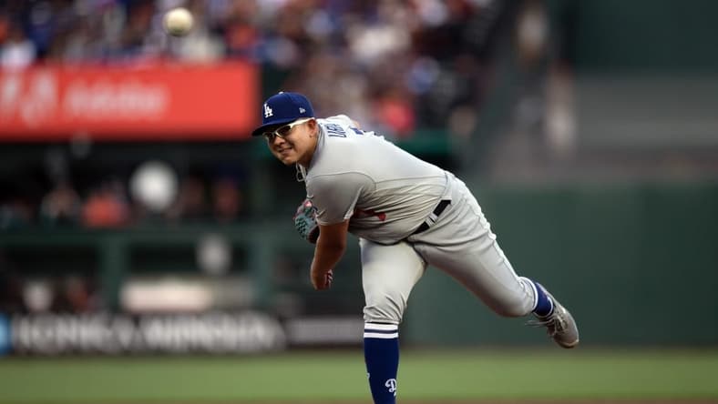 Apr 10, 2023; San Francisco, California, USA; Los Angeles Dodgers starting pitcher Julio Urias (7) delivers a pitch against the San Francisco Giants during the first inning at Oracle Park. Mandatory Credit: D. Ross Cameron-USA TODAY Sports