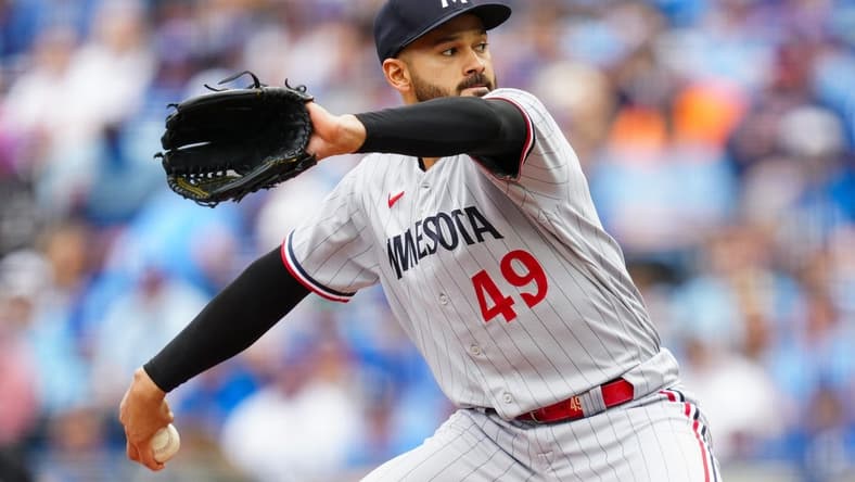 Mar 30, 2023; Kansas City, Missouri, USA; Minnesota Twins starting pitcher Pablo Lopez (49) pitches during the first inning against the Kansas City Royals at Kauffman Stadium. Mandatory Credit: Jay Biggerstaff-USA TODAY Sports