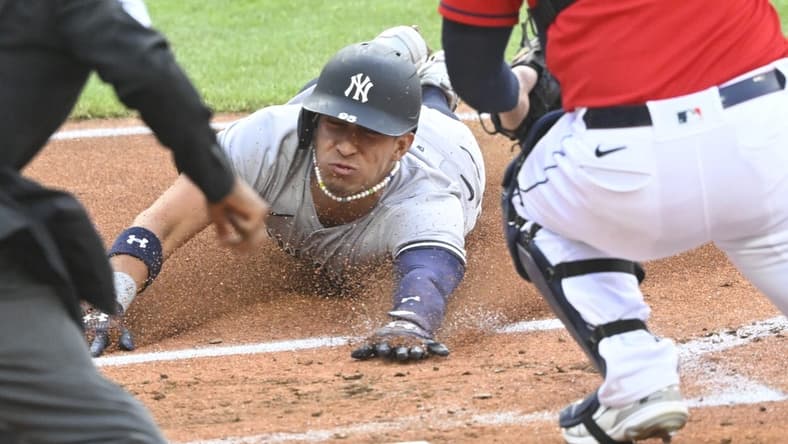 Apr 11, 2023; Cleveland, Ohio, USA; New York Yankees shortstop Oswaldo Cabrera (95) scores in the second inning against the Cleveland Guardians at Progressive Field. Mandatory Credit: David Richard-USA TODAY Sports