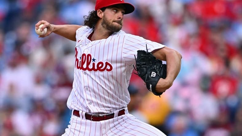 Apr 11, 2023; Philadelphia, Pennsylvania, USA; Philadelphia Phillies starting pitcher Aaron Nola (27) throws a pitch against the Miami Marlins in the first inning at Citizens Bank Park. Mandatory Credit: Kyle Ross-USA TODAY Sports
