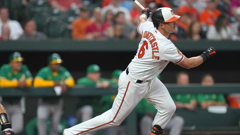 Apr 11, 2023; Baltimore, Maryland, USA; Baltimore Orioles first baseman Ryan Mountcastle (6) drives home shortstop Jorge Mateo (not shown) in the third inning against the Oakland Athletics at Oriole Park at Camden Yards. Mandatory Credit: Mitch Stringer-USA TODAY Sports