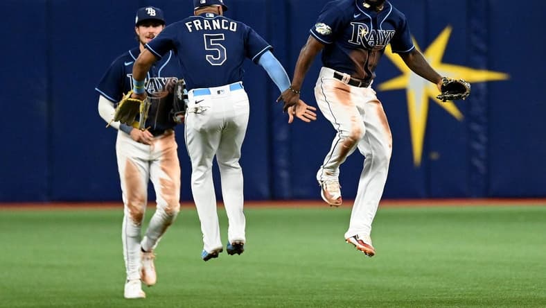 Apr 11, 2023; St. Petersburg, Florida, USA; Tampa Bay Rays left fielder Randy Arozarena (56) and shortstop Wander Franco (5) celebrate  after defeating the Boston Red Sox at Tropicana Field. Mandatory Credit: Jonathan Dyer-USA TODAY Sports