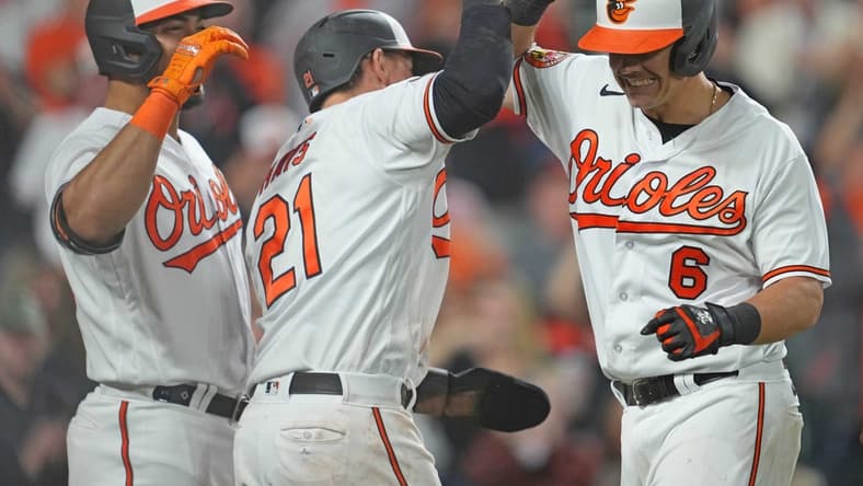 Apr 11, 2023; Baltimore, Maryland, USA; Baltimore Orioles first baseman Ryan Mountcastle (6) greeted by outfielders Austin Hays (21) and Anthony Santander (25) following his seventh inning grand slam against the Oakland Athletics at Oriole Park at Camden Yards. Mandatory Credit: Mitch Stringer-USA TODAY Sports