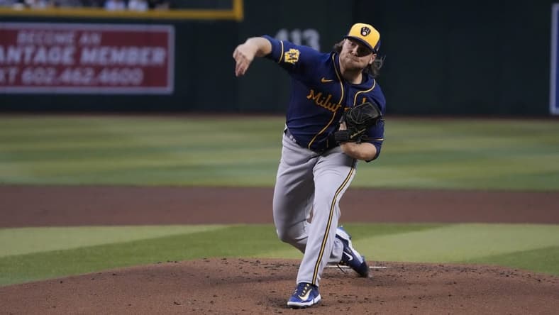 Apr 11, 2023; Phoenix, Arizona, USA; Milwaukee Brewers starting pitcher Corbin Burnes (39) throws against the Arizona Diamondbacks in the first inning at Chase Field. Mandatory Credit: Rick Scuteri-USA TODAY Sports