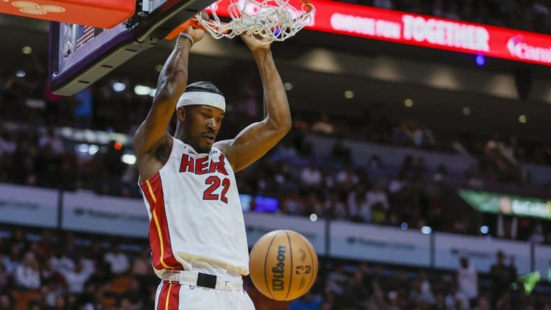 Apr 11, 2023; Miami, Florida, USA; Miami Heat forward Jimmy Butler (22) dunks the ball during the third quarter against the Atlanta Hawks at Kaseya Center. Mandatory Credit: Sam Navarro-USA TODAY Sports