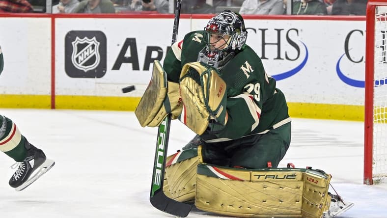 Apr 11, 2023; Saint Paul, Minnesota, USA; Minnesota Wild goalie Marc-Andre Fleury (29) makes a glove save against the Winnipeg Jets during the third period at at Xcel Energy Center. Mandatory Credit: Nick Wosika-USA TODAY Sports