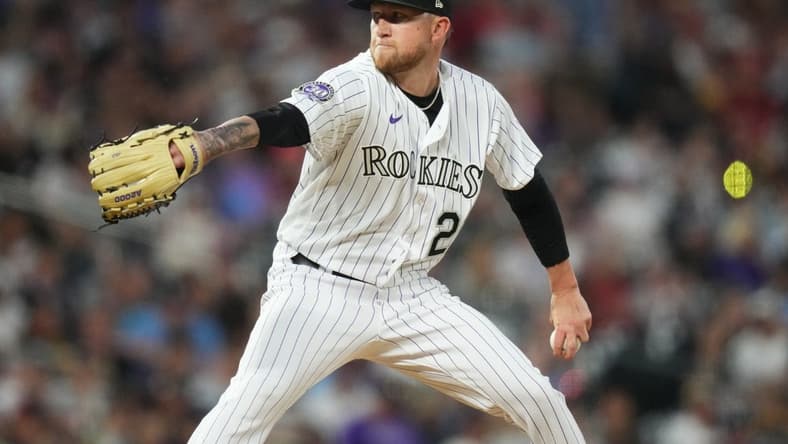 Apr 11, 2023; Denver, Colorado, USA; Colorado Rockies starting pitcher Kyle Freeland (21) delvers a pitch in the fifth inning against the St. Louis Cardinals at Coors Field. Mandatory Credit: Ron Chenoy-USA TODAY Sports