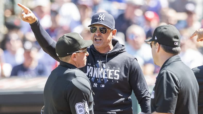 Apr 12, 2023; Cleveland, Ohio, USA; New York Yankees manager Aaron Boone argues a call with umpire Chris Guccione (68) during the first inning against the Cleveland Guardians at Progressive Field. Boone was ejected. Mandatory Credit: Ken Blaze-USA TODAY Sports