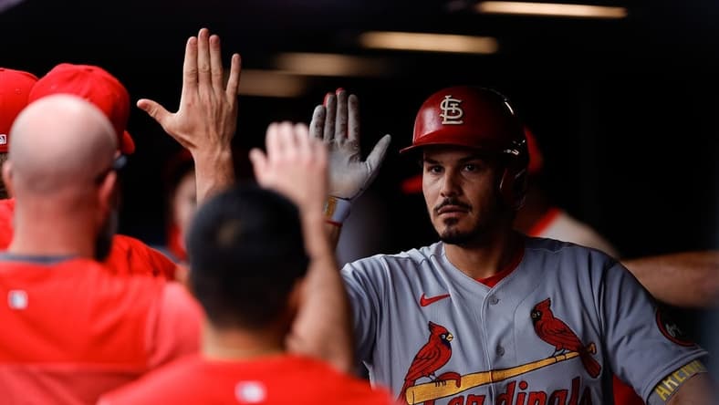Apr 12, 2023; Denver, Colorado, USA; St. Louis Cardinals designated hitter Nolan Arenado (28) celebrates in the dugout on a two run home run in the fourth inning against the Colorado Rockies at Coors Field. Mandatory Credit: Isaiah J. Downing-USA TODAY Sports
