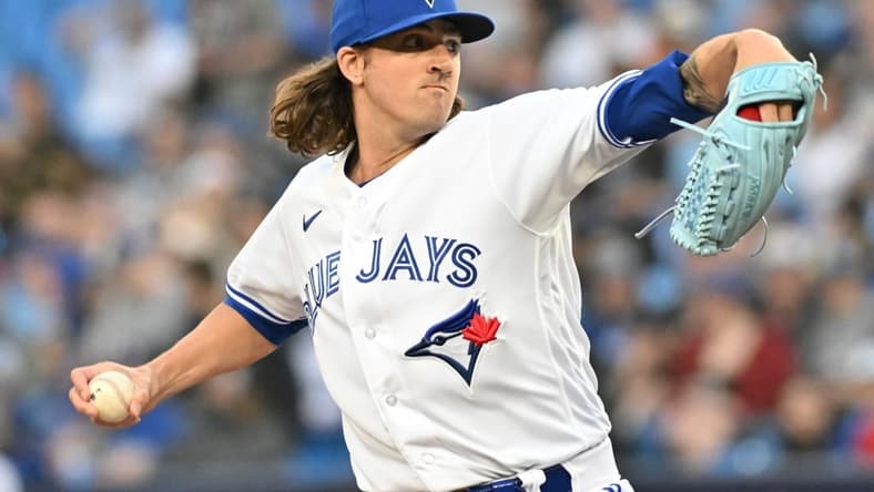 Apr 12, 2023; Toronto, Ontario, CAN;  Toronto Blue Jays starting pitcher Kevin Gausman (34) delivers a pitch against the Detroit Tigers in the first inning at Rogers Centre. Mandatory Credit: Dan Hamilton-USA TODAY Sports