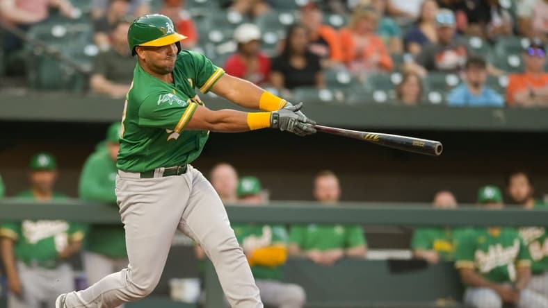 Apr 12, 2023; Baltimore, Maryland, USA;  Oakland Athletics catcher Carlos Perez (44) singles during the second inning against the Baltimore Orioles at Oriole Park at Camden Yards. Mandatory Credit: Tommy Gilligan-USA TODAY Sports