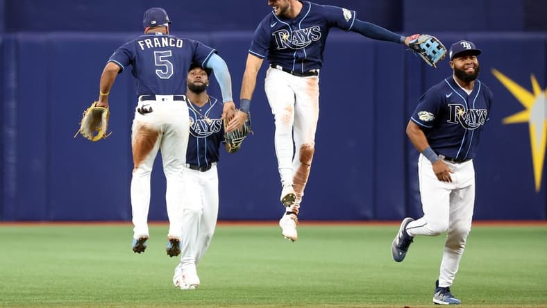 Apr 12, 2023; St. Petersburg, Florida, USA; Tampa Bay Rays shortstop Wander Franco (5), right fielder Josh Lowe (15), right fielder Manuel Margot (13) and left fielder Randy Arozarena (56) celebrate after they defeated the Boston Red Sox at Tropicana Field. Mandatory Credit: Kim Klement-USA TODAY Sports