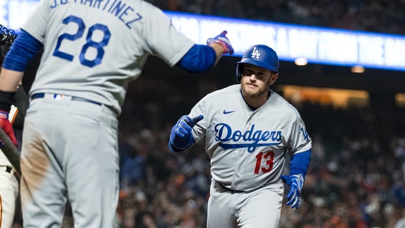 Apr 12, 2023; San Francisco, California, USA;  Los Angeles Dodgers third baseman Max Muncy (13) is congratulated by designated hitter J.D. Martinez (28) after he hit a solo home run against the San Francisco Giants during the fifth inning at Oracle Park. Mandatory Credit: John Hefti-USA TODAY Sports