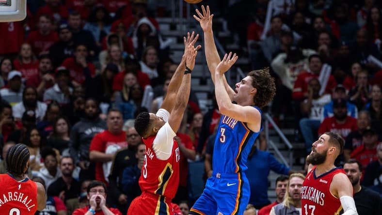 Apr 12, 2023; New Orleans, Louisiana, USA; Oklahoma City Thunder guard Josh Giddey (3) shoots a jump shot over New Orleans Pelicans guard CJ McCollum (3) during the second half at Smoothie King Center. Mandatory Credit: Stephen Lew-USA TODAY Sports