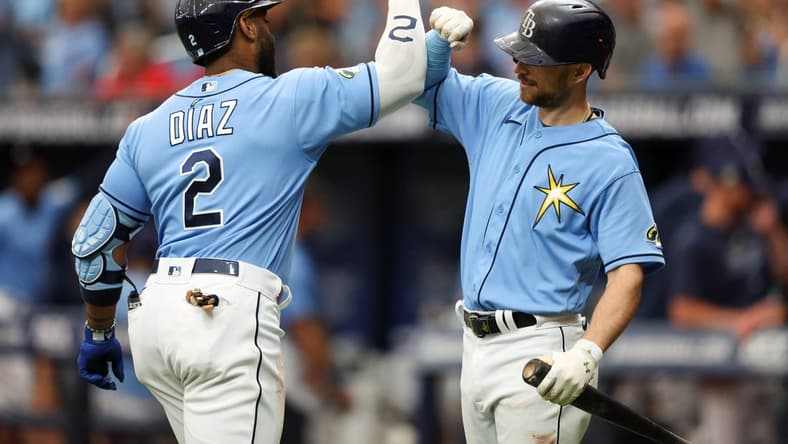 Apr 13, 2023; St. Petersburg, Florida, USA;  Tampa Bay Rays first baseman Yandy Diaz (2) celebrates with Tampa Bay Rays second baseman Brandon Lowe (8) after hitting a home run against the Boston Red Sox in the first inning at Tropicana Field. Mandatory Credit: Nathan Ray Seebeck-USA TODAY Sports