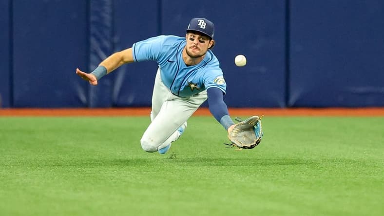 Apr 13, 2023; St. Petersburg, Florida, USA;  Tampa Bay Rays center fielder Josh Lowe (15) dives for a ball against the Boston Red Sox in the fifth inning at Tropicana Field. Mandatory Credit: Nathan Ray Seebeck-USA TODAY Sports