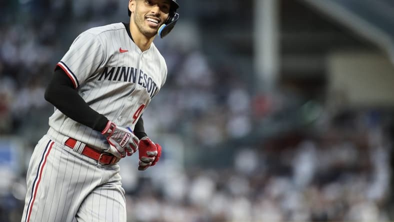 Apr 13, 2023; Bronx, New York, USA;  Minnesota Twins shortstop Carlos Correa (4) reacts after hitting a sole home run in the first inning against the New York Yankees at Yankee Stadium. Mandatory Credit: Wendell Cruz-USA TODAY Sports
