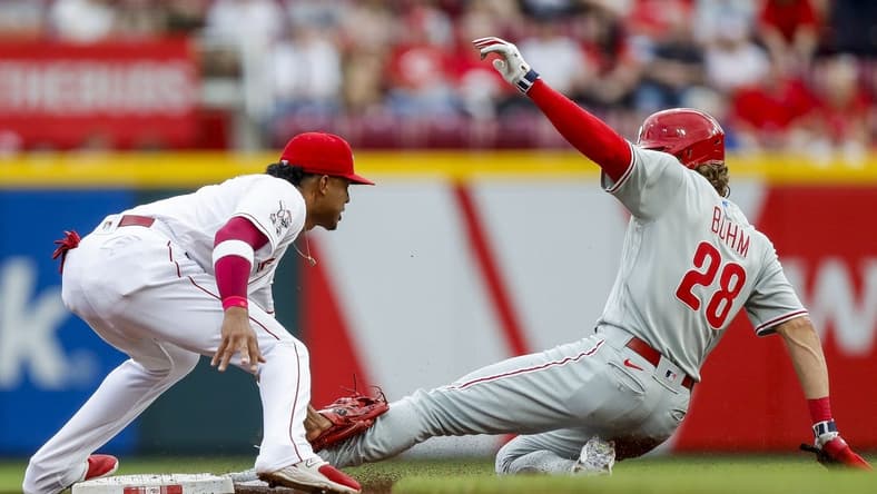 Apr 14, 2023; Cincinnati, Ohio, USA; Cincinnati Reds shortstop Jose Barrero (2) tags Philadelphia Phillies first baseman Alec Bohm (28) out at second in the second inning at Great American Ball Park. Mandatory Credit: Katie Stratman-USA TODAY Sports