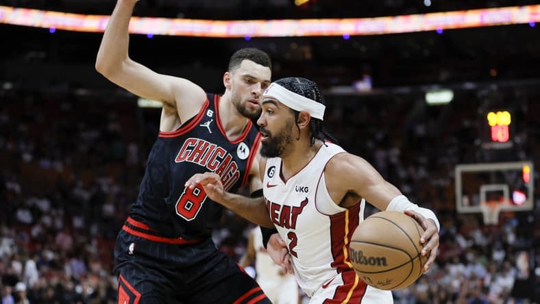 Apr 14, 2023; Miami, Florida, USA; Miami Heat guard Gabe Vincent (2) drives to the basket against Chicago Bulls guard Zach LaVine (8) during the second quarter at Kaseya Center. Mandatory Credit: Sam Navarro-USA TODAY Sports