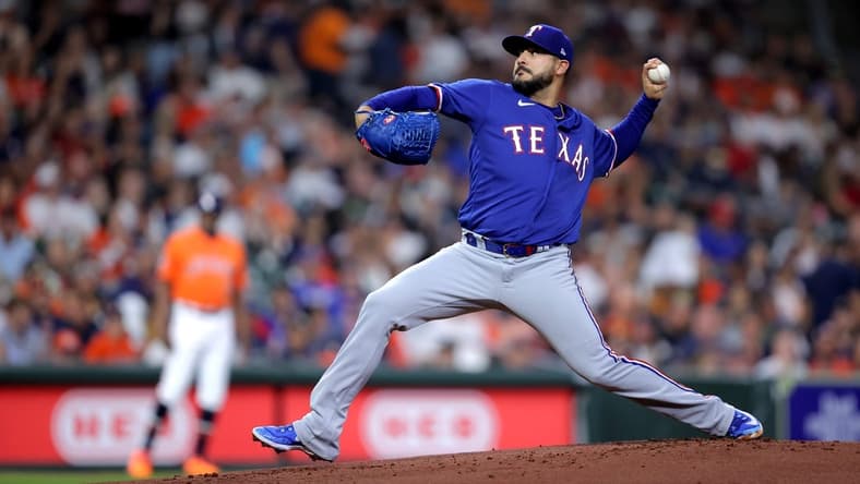 Apr 14, 2023; Houston, Texas, USA; Texas Rangers starting pitcher Martin Perez (54) delivers a pitch against the Houston Astros during the first inning at Minute Maid Park. Mandatory Credit: Erik Williams-USA TODAY Sports