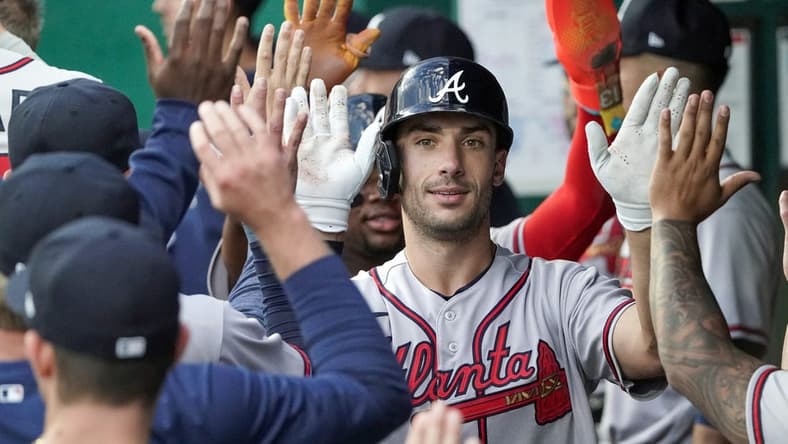 Apr 14, 2023; Kansas City, Missouri, USA; Atlanta Braves first baseman Matt Olson (28) is congratulated in the dugout after hitting a home run against the Kansas City Royals during the first inning at Kauffman Stadium. Mandatory Credit: Denny Medley-USA TODAY Sports