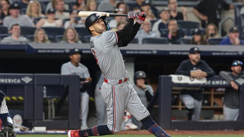 Apr 14, 2023; Bronx, New York, USA; Minnesota Twins shortstop Carlos Correa (4) looks up at his solo home run during the sixth inning against the New York Yankees at Yankee Stadium. Mandatory Credit: Vincent Carchietta-USA TODAY Sports