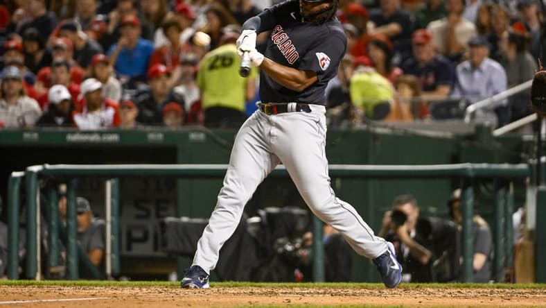 Apr 14, 2023; Washington, District of Columbia, USA; Cleveland Guardians designated hitter Josh Bell (55) hits a double against the Washington Nationals during the eighth inning at Nationals Park. Mandatory Credit: Brad Mills-USA TODAY Sports