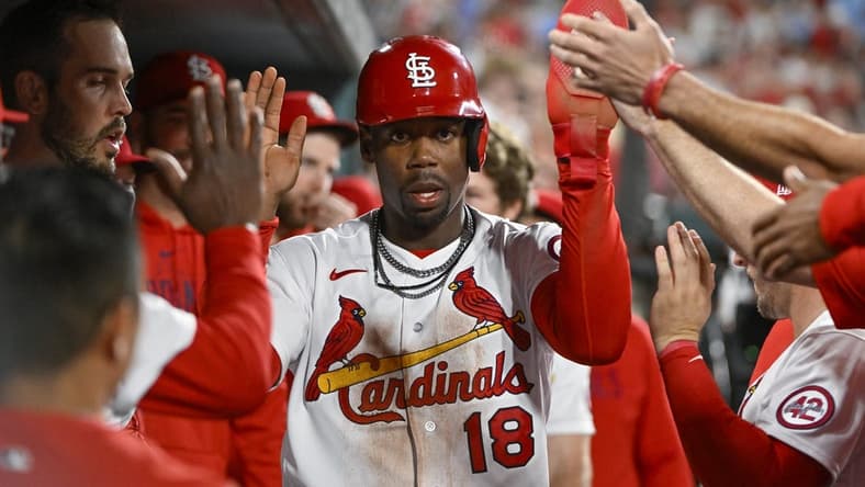 Apr 14, 2023; St. Louis, Missouri, USA;  St. Louis Cardinals pinch runner Jordan Walker (18) is congratulated by teammates after scoring against the Pittsburgh Pirates during the eighth inning at Busch Stadium. Mandatory Credit: Jeff Curry-USA TODAY Sports