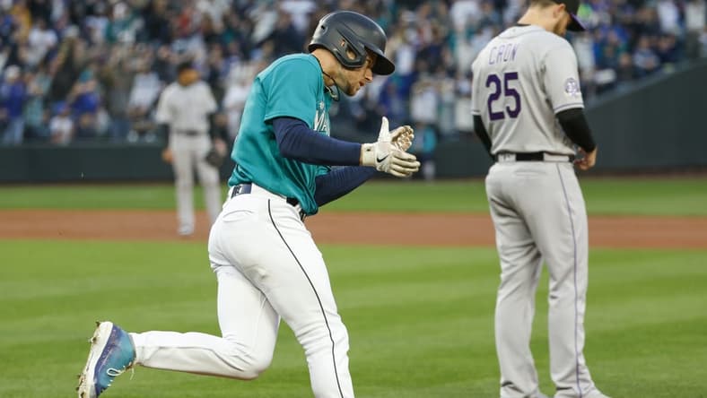 Apr 14, 2023; Seattle, Washington, USA; Seattle Mariners left fielder Jarred Kelenic (10) celebrates after hitting a two-run home run against the Colorado Rockies during the second inning at T-Mobile Park. Mandatory Credit: Joe Nicholson-USA TODAY Sports