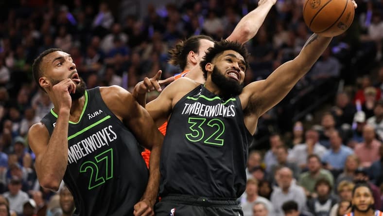 Apr 14, 2023; Minneapolis, Minnesota, USA; Minnesota Timberwolves center Karl-Anthony Towns (32) rebounds the ball against the Oklahoma City Thunder during the second quarter at Target Center. Mandatory Credit: Matt Krohn-USA TODAY Sports