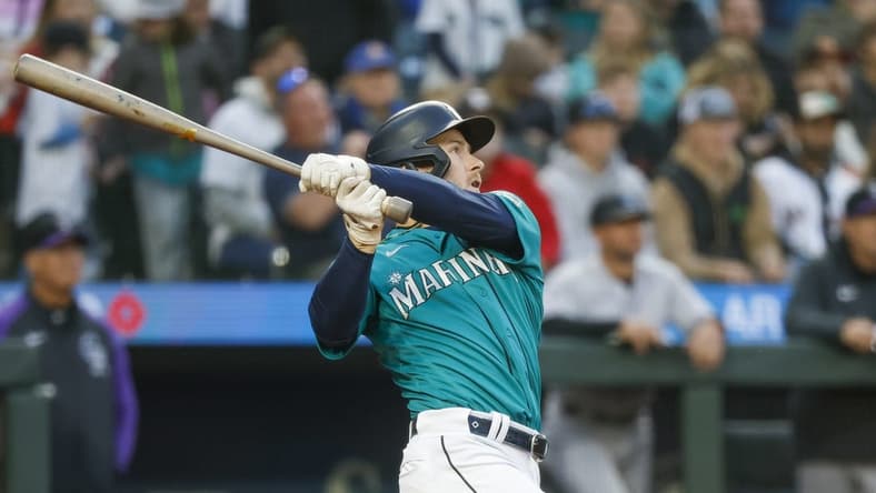 Apr 14, 2023; Seattle, Washington, USA; Seattle Mariners left fielder Jarred Kelenic (10) watches after hitting a two-run home run against the Colorado Rockies during the second inning at T-Mobile Park. Mandatory Credit: Joe Nicholson-USA TODAY Sports