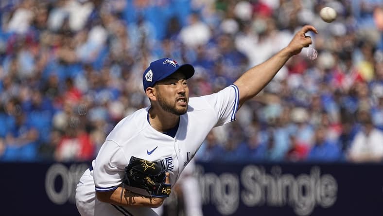 Apr 15, 2023; Toronto, Ontario, CAN; Toronto Blue Jays pitcher Yusei Kikuchi pitches to the Tampa Bay Rays during the first inning on Jackie Robinson day at Rogers Centre. Mandatory Credit: John E. Sokolowski-USA TODAY Sports