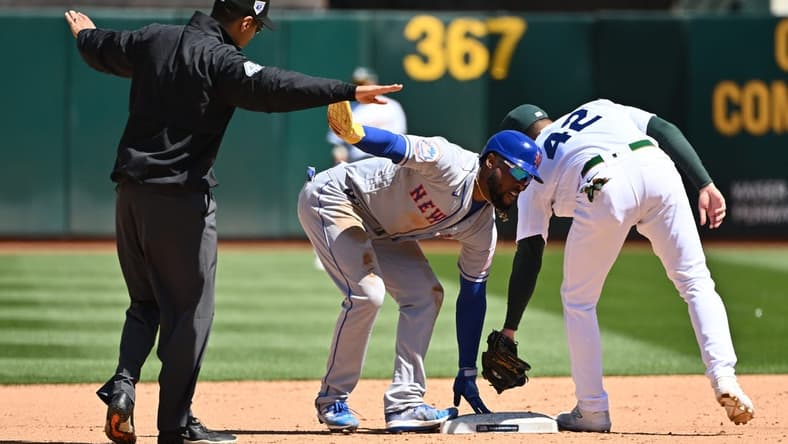 Apr 15, 2023; Oakland, California, USA; New York Mets right fielder Starling Marte (6) calls for time and umpire Gabe Morales (47) makes the call of safe during the sixth inning at RingCentral Coliseum. Mandatory Credit: Robert Edwards-USA TODAY Sports