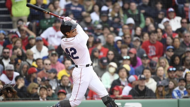 Apr 15, 2023; Boston, Massachusetts, USA; Boston Red Sox short stop Yu Chang (20) hits a two run home run during the fourth inning against the Los Angeles Angels at Fenway Park. Mandatory Credit: Bob DeChiara-USA TODAY Sports