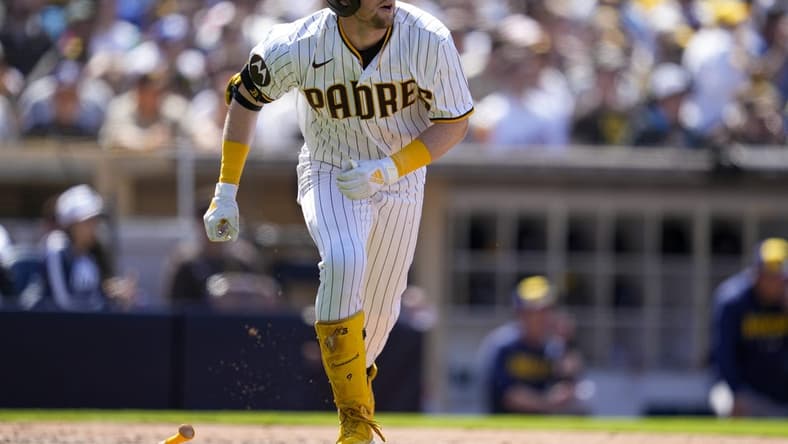 Apr 15, 2023; San Diego, California, USA;  San Diego Padres second baseman Jake Cronenworth (9) hits a two run home run against the Milwaukee Brewers during the fifth inning at Petco Park. Mandatory Credit: Ray Acevedo-USA TODAY Sports