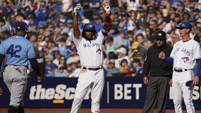 Apr 15, 2023; Toronto, Ontario, CAN; Toronto Blue Jays designated hitter Vladimir Guerrero Jr. celebrates hitting a single against the Tampa Bay Rays during the seventh inning at Rogers Centre. Mandatory Credit: John E. Sokolowski-USA TODAY Sports